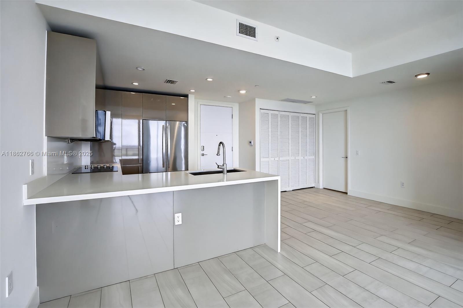 Spacious 2BR/2BA + den at Metropica in Sawgrass (one of the larger floor plans). Features European-style cabinetry, quartz countertops, stainless-steel appliances, porcelain tile floors, and walk-in closets. One assigned covered garage space. Resort-level amenities: 24-hour concierge & security, 24-hour fitness center, indoor/outdoor massage rooms, steam room & sauna, resort pool with sun shelf, poolside cabanas & lounges, two full-size tennis courts, indoor children’s play areas, clubroom with bar, and indoor surround-sound theater. Vacant—easy to show.