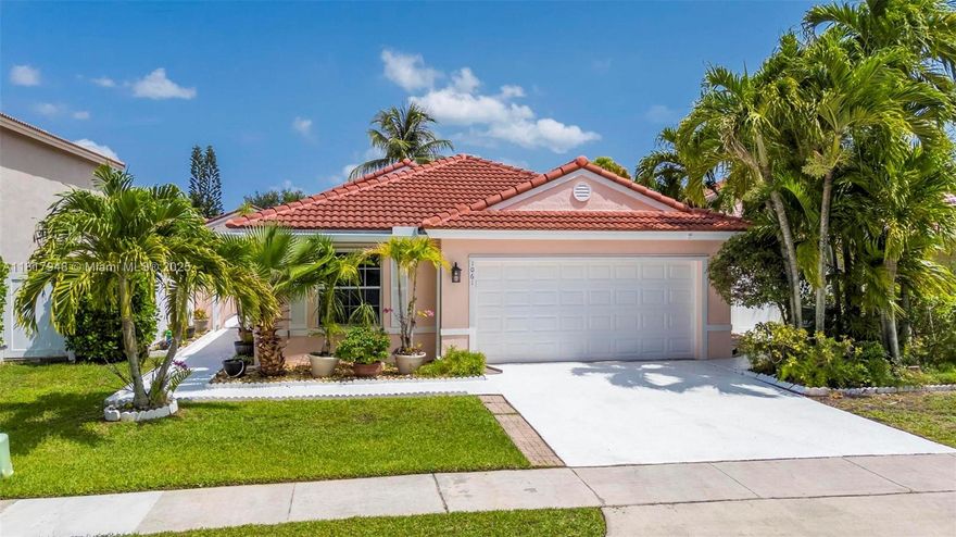 Beautiful 3/2 home in prestigious Kensington at Chapel Trail! Features a new 2023 roof, hurricane shutters throughout, and an impact-rated garage door. Enjoy a lush garden with a mango tree, refreshed landscaping, and a spacious outdoor area perfect for entertaining. The bright, open layout includes tile floors, vaulted ceilings, and a split bedroom plan for added privacy. The kitchen offers ample cabinet space and a breakfast nook overlooking the yard. Low HOA, community amenities, and fiber internet available. Located near top-rated schools, beautiful parks, shopping, dining, and with easy highway access—perfect for families seeking comfort, convenience, and tranquility. Don’t miss this opportunity to live the true Florida lifestyle in a well-maintained home and desirable neighborhood!