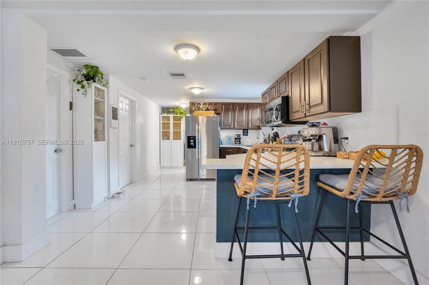 Step into this beautifully remodeled 3-bedroom, 2.5-bathroom home, completely updated from top to bottom in 2021. Electrical, plumbing, roof, and impact windows were all upgraded in 2021, offering peace of mind for years to come. The bright open layout is filled with natural light, and the stunning kitchen features quartz countertops and 2021 stainless steel appliances. Enjoy the convenience of a dedicated laundry room and well-designed living spaces, including generously sized bedrooms and bathrooms.
Situated on a spacious 7,000 sq ft lot, the property offers plenty of outdoor space for relaxing or entertaining. Ideally located just minutes from I-95, Miami Shores, Publix, this home delivers comfort and exceptional convenience. Perfect for buyers seeking a move-in-ready property!