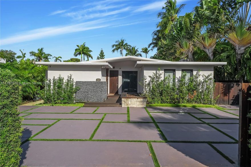 Welcome to a reimagined oasis on exclusive Hibiscus Island. This fully remodeled 4-bedroom, 3-bath family retreat spans 2,774 sq ft and includes a versatile media room/office. Designed for effortless indoor-outdoor living, the open layout flows from a spacious eat-in kitchen to elegant living and dining areas that lead to a salt water heated pool, tiki hut, gas generator, and a Tesla charger. Featured in Better Homes and Gardens, the serene, L-shaped floor plan centers around a tranquil master suite with ensuite bath and walk-in wardrobe. Offered turn key furnished, and available for short-term leases up to 3 months, this zen-inspired residence is ideal for refined island living with the convenience of flexible terms.