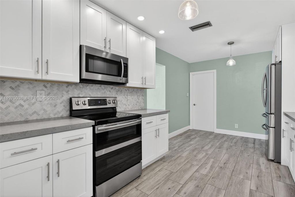 Photo of 7613 NW 67th Ave, Tamarac, FL 33321 (MLS # A11975038)