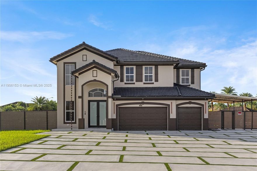 Modern and luminous two-story corner-lot home, completely move-in ready. Features a legal attached in-law suite with private entrance: living area, kitchenette, dining space, separate bedroom and full bath—perfect for guests, multigenerational living, or rental income. Oversized master suite, three-car garage, and a large covered area built to handle a boat, extra cars, trucks or RVs. Outdoor kitchen for al-fresco entertaining under cover. Dual access via SW 222nd St and SW 129th Ave for added flexibility. No HOA, no restrictions—freedom, space and convenience in a growing Miami-Dade locale close to shops, parks and major commuting routes.