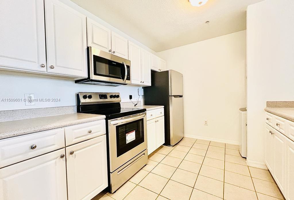 Photo of 1200 Town Center Dr #406, Jupiter, FL 33458 (MLS # A11509601)