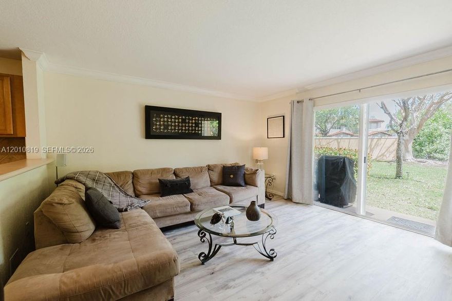 This beautifully cared for 3 bedroom 3 bath corner townhouse has been lived in by only the original owner and perfectly maintained since day one. Located in a desirable gated community in Miramar with low HOA fees and 24 hour security, this home offers excellent flexibility for primary residents and investors alike. The smart functional layout features a first floor bedroom and full bathroom, perfect for guests or extended family. The open concept kitchen flows seamlessly into the main living area and includes generous cabinetry, a pantry, and plenty of natural light throughout the home. Upstairs you will find a spacious primary suite complete with two walk in closets, an ensuite bathroom, and a private balcony. This property stands out offering a private, safe, and ample backyard with no rear neighbors for added privacy and enjoyment. Residents enjoy access to outstanding resort style amenities including a pool, fitness center, clubhouse, and playground. The HOA covers cable, internet, trash, sewer, property insurance and roof maintenance. Conveniently located near I 75 and the Turnpike, this home is just minutes from shopping, dining, top rated schools, parks, and everyday conveniences.