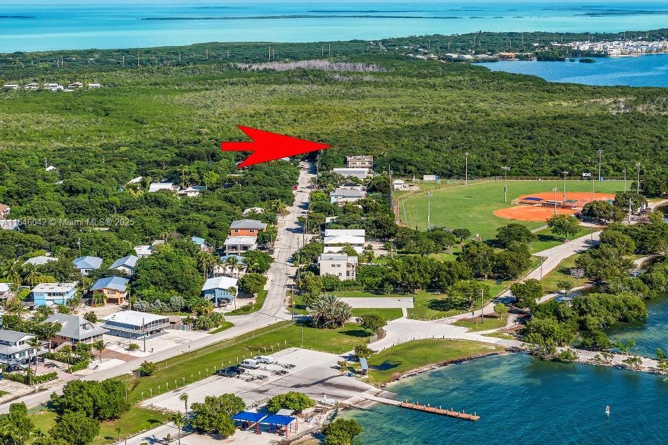 Vacant Lot available in Harry Harris Park. This neighborhood has a community oceanfront park with boat ramp, playground, picnic - beach area and ball fields. Tavernier Creek is close by giving boaters access to the Florida Bay. Adjacent Lot with active permit is also available and can be purchased together.