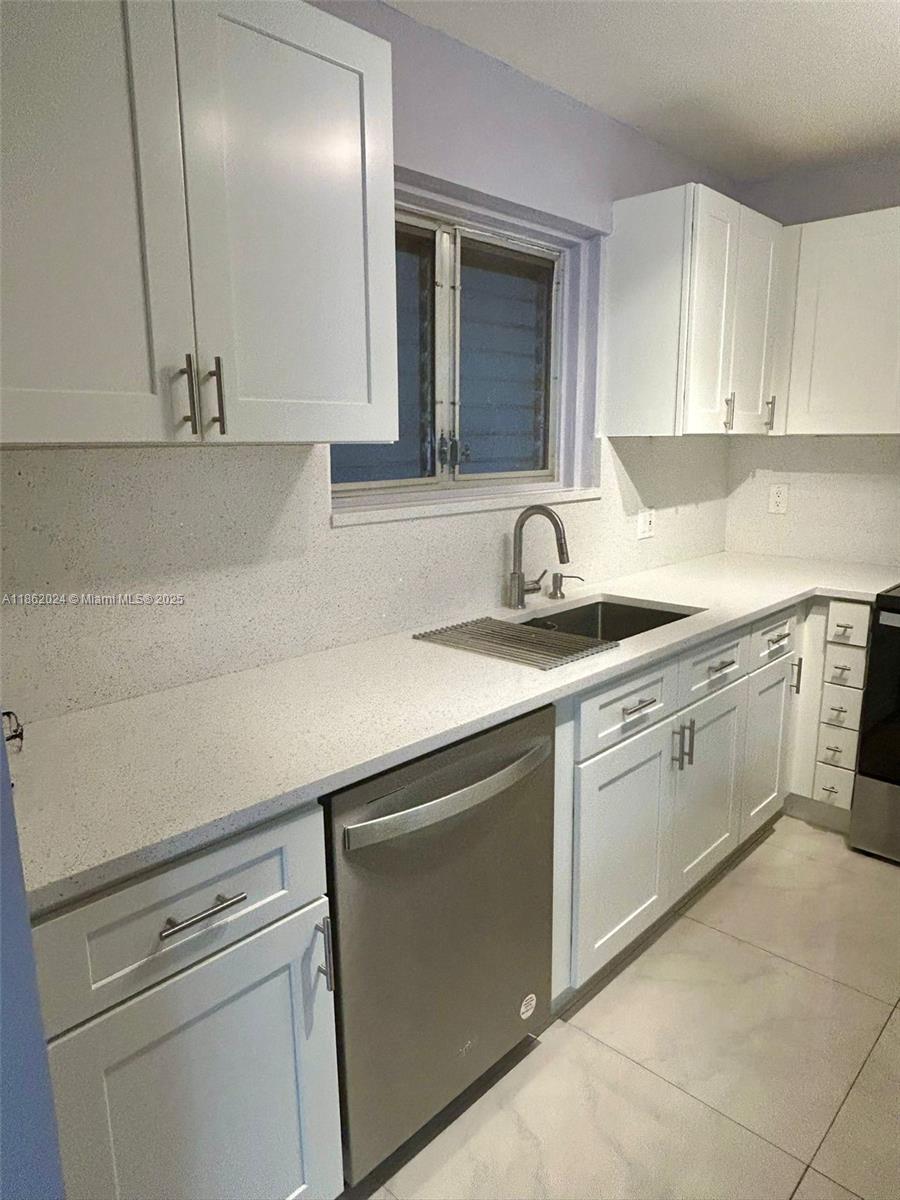 Fully renovated 2/2 unit in lovely Laurels at Margate. This charming condo is on the first-floor, it offers a comfortable living space, and a full size Washer and dryer in the unit. Close to shopping, like Walmart, Marshall, Turnpike, 441, hospitals and more.Enjoy a modern, new kitchen, featuring stainless steel appliances and an open-concept layout, dining, and living areas. The spacious living room opens up to a spacious porch with storage, enhancing your entertaining options. Each bedroom includes a ceiling fan. Freshly painted in a light, nice lavender color. The community is getting revamped, new roofs have been installed and new parking paving. Utilities included: water, trash service, and yard maintenance, ensuring hassle-freeliving. Gym, barbecue, sports center, and community pool.