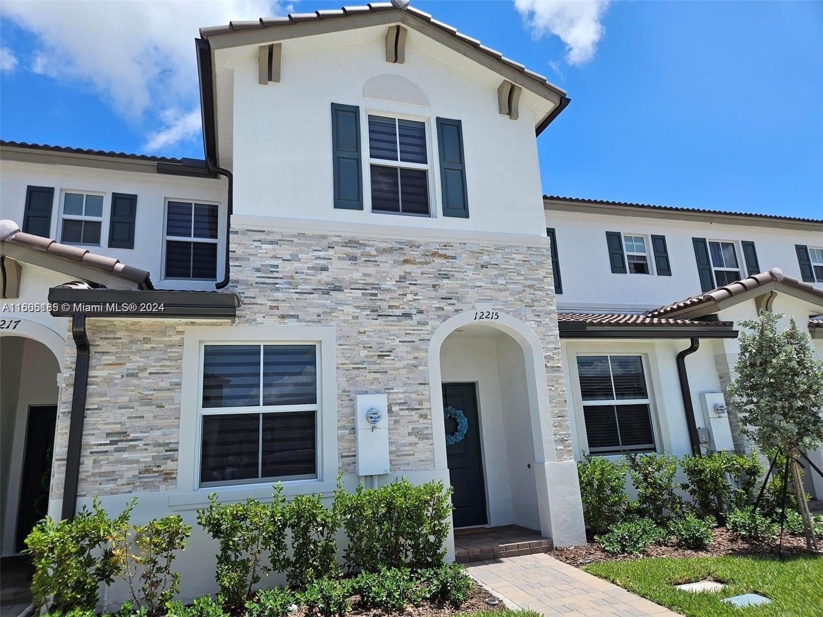BEAUTIFUL NEW TOWNHOME WITH ENCLOSED PATIO AREA. COMMUNITY WITH GUARDHOUSE AT ENTRANCE. CLUBHOUSE WITH POOL, GYM, PLAY AREA, AND DOG PARK AREA. TILED THROUGHOUT FIRST FLOOR, UPGRADED QUARTZ KITCHEN COUNTERTOP, UPGRADED STAINLESS STEEL APPLIANCES IN KITCHEN, NEW BLINDS ON ALL WINDOWS AND SLIDING GLASS DOORS, TANKLESS WATER HEATER, AND UPGRADED IMPACT WINDOWS. CALL TODAY FOR MORE INFORMATION AND APPOINTMENTS!