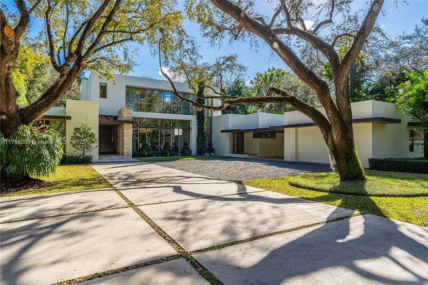 Reminiscent of the work of Richard Neutra, this Mid-Century Modern estate, designed by Taylor & Taylor & built by Coastal Construction, is located in coveted Hammock Lakes. Tucked away in a gated community, & extremely private & secure, the home is situated among countless Mature Oak trees on a full acre of land. This recently updated 2-story, 8-bedroom home features natural stone & wood floors. Elegantly & stylishly appointed by a top-flight designer, this estate is perfect for the buyer who wants to move in tomorrow. Features include a Ground Floor Primary; large living room with fireplace; oversized dining room; gourmet kitchen; spacious pool, open lawns and cabana/guest house; Smart House; an abundance of natural light throughout the day both indoors and outdoors. NO expense spared.
