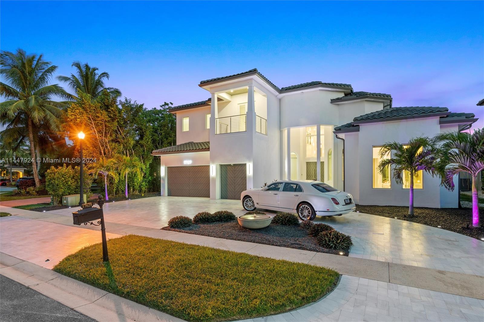 Just reduced $500,000 for a FAST sale! Gorgeous Miami style custom home. In the Oaks of Boca Raton every conceivable upgrade on this immaculate super-smart home is present. Gaggenau appliances, 90 inch wide Liebherr refrigerators with built in wine section, dual electric and gas range and inlaid gold lighting. Swarovski Crystal chandelier lighting in the main living room. Completely open to the outside by massive quad-fold doors to a full quartzite outdoor kitchen by the oversized LED lit pool and hot tub overlooking the lake. Ensuite bath in every room. Hand painted tiles, digital command lighting and blinds. Gorgeous Calacatta marble pool deck and driveway plus complete whole home generator and Low E impact glass throughout. This is truly a one off special home.
