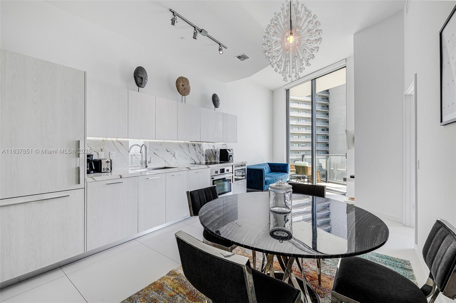 Own Miami's ultimate luxury with this upscale 1-bedroom plus den (746 SF) condo in Edgewater. Enjoy 12 ft ceilings, stylish furnishings, premium amenities, and breathtaking views of Downtown and Miami Beach Skyline. Plus, the building offers a wealth of amenities including a tennis court, two pools, BBQ area, kids room, social room, sauna, fitness room, theater, valet, front desk 24/7, and billiard room. Condo comes with one assigned parking, and one storage room located on the second floor under AC. Building allows 12 rentals per year, min 30 days.