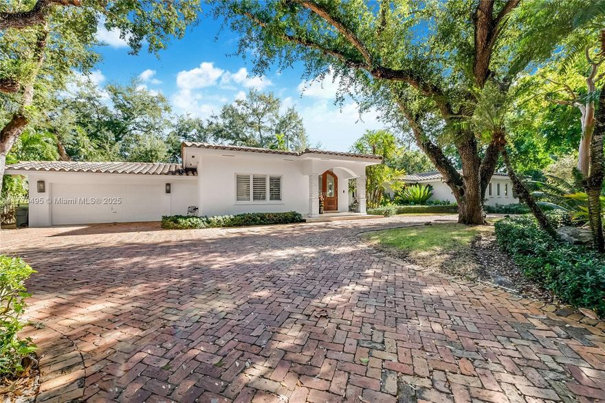 Nestled on a charming tree-lined street in Coral Gables, this updated 4,187 sqft home offers 5 bedrooms, 4.5 bathrooms, 3 outdoor patio living areas and sits on a 15,000 sqft lot. The open layout features spacious living rooms and a remodeled kitchen with a breakfast area overlooking the patio and pool. A formal dining room seats 10-12, while a versatile extra room serves as a playroom, office, or den. Bathrooms include new vanities, upscale finishes, and glass shower enclosures. Highlights: marble flooring, LED lights, impact glass, walk-in closets, and a primary suite with a private patio and spa-like bath. Updated landscaping, new turf yard, and gated entry. Quiet street in a primate central location just minutes from Coral Gables, Coconut Grove, South Miami, and top schools.