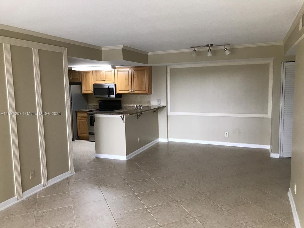 Photo of 10709 Cleary Blvd #106, Plantation, FL 33324 (MLS # A11596207)