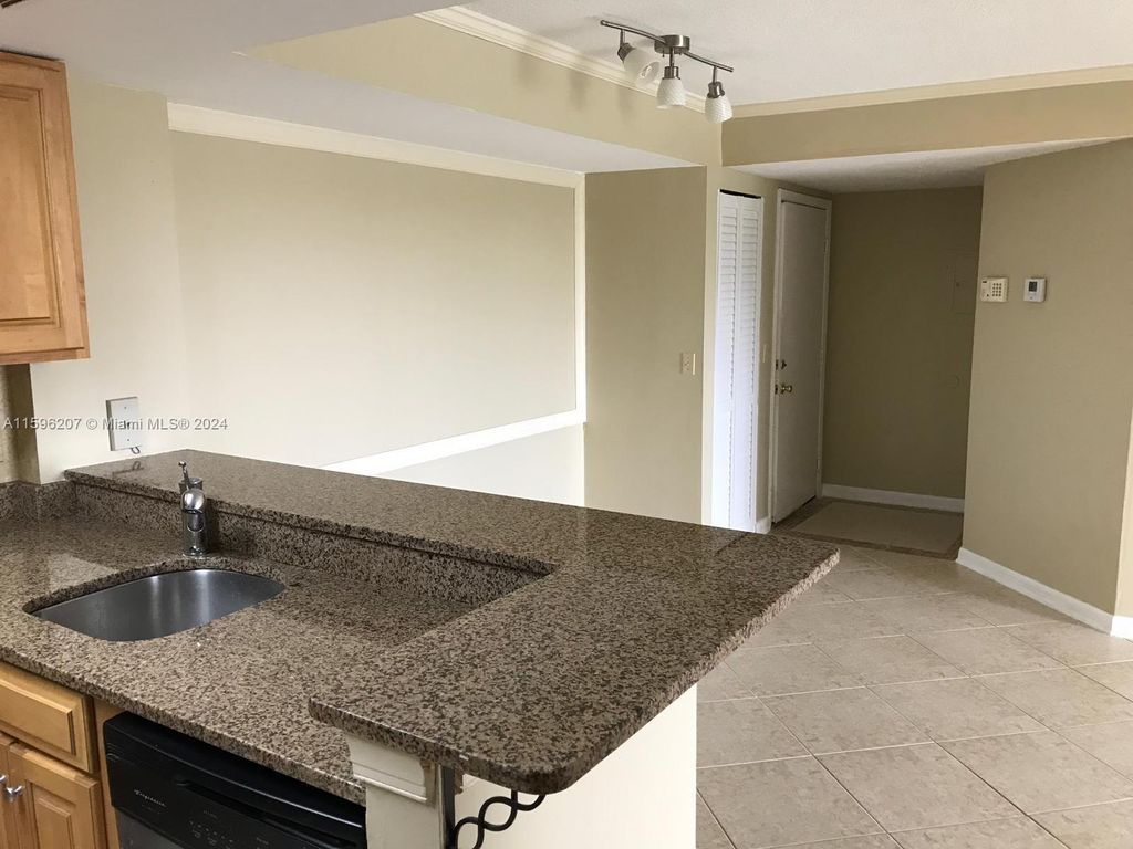Photo of 10709 Cleary Blvd #106, Plantation, FL 33324 (MLS # A11596207)