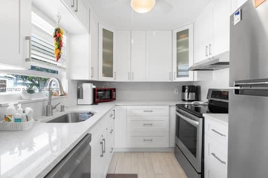 NEW TO THE MARKET TODAY! SPECTACULAR SPACIOUS 2/2 SECOND FLOOR CONDO IN THE SERENE BRITTANY SECTION OF KINGS POINT DELRAY BEACH. NEVER WORRY WITH THE FULL IMPACT DOORS AND WINDOWS. TOP OF THE LINE KITCHEN WITH SOFT CLOSE DRAWERS, PANTRY, GORGEOUS QUARTZ COUNTERS AND STAINLESS APPLIANCES. HIGH QUALITY DISTRESSED LOOK PORCELAIN TILES THROUGHOUT. BRAND NEW A/C IN 2025! TWO AMAZING TILED BATHROOMS WITH THE FINEST OF DESIGNER FINISHES. ENJOY TONS OF NATURAL LIGHT. ELEVATOR LIFT VERY CLOSE. PRIVATE SCREEN ENCLOSED PATIO WITH FULL SIZED WASHER/DRYER. 5 CEILING FANS, CUSTOM LIGHTING THROUGHOUT AND MORE. HUGE WALK IN CLOSET. THREE CLUBHOUSES WITH THE FINEST OF AMMENITIES. TENNIS, PICKLEBALL, BOCCE, SPA, THEATER, POOLS, SHOWS, 18 HOLE GOLF COURSE, DINING, SHUTTLE SERVICE AND MORE. VA APPROVED CONDO!