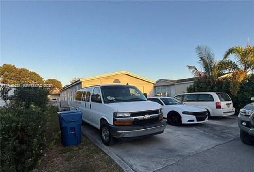 Beautifully updated, ready to move in! freshly painted inside and out, kitchen redone, new modern flooring! AC is 3 years old High efficiency unit, water heater is a year old. Beautiful community has 24 hour security, 2 pools, Basketball court, tennis court rec room and kids playground! Additional parking for boats and RV. This home is move in condition