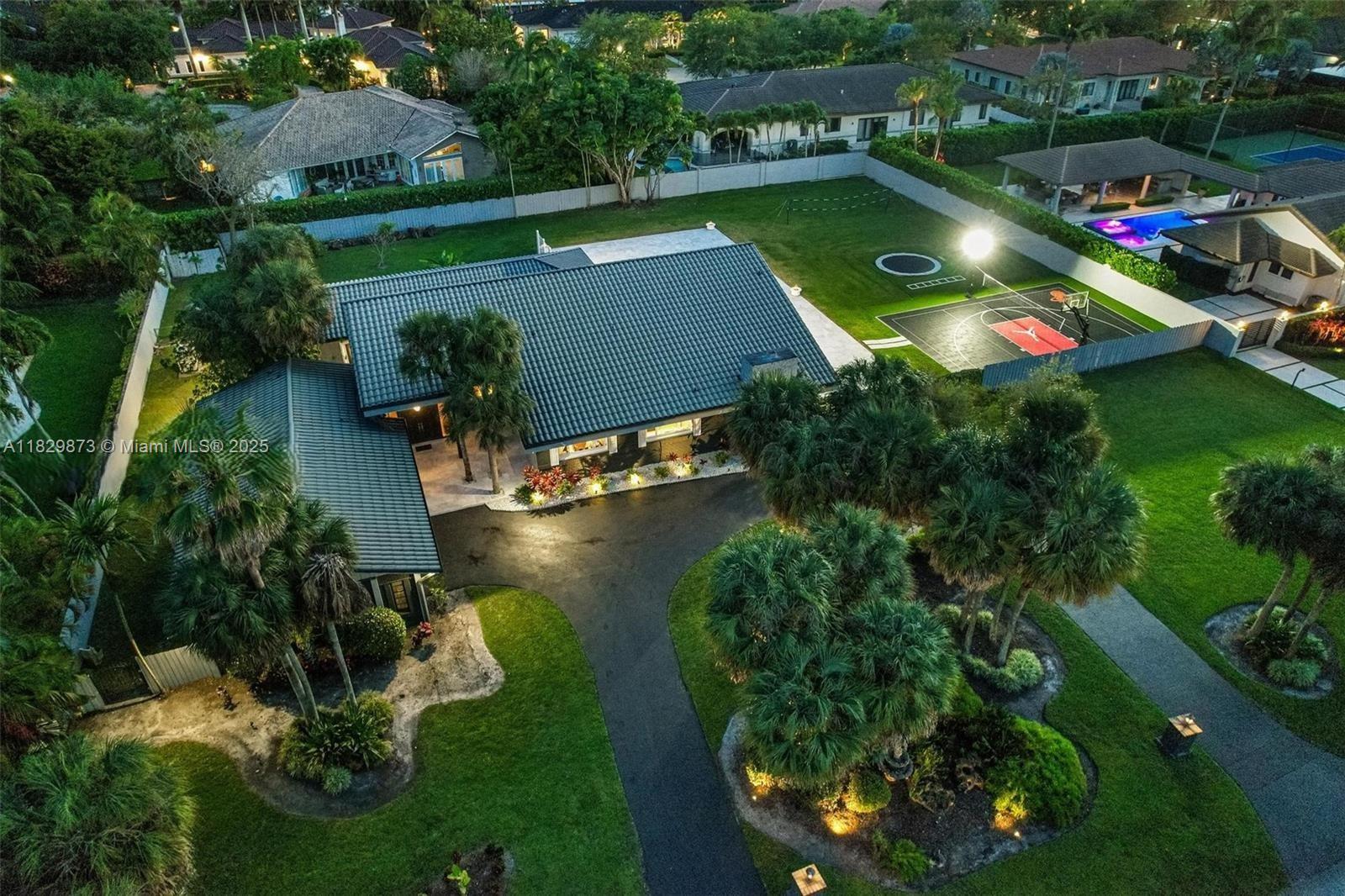 This magnificent residence in GALLOWAY GLEN, sits on a generous 39,640SF lot. The property includes 5BR, 3.5BA , and 4,779SF of matchless comfort living space. Greeted with a Grand entrance and an intimate courtyard, the living areas of this elegant home are complemented by a family room featuring a striking stone wall and a wood-burning fireplace. The primary suite is a perfect retreat, equipped with separate walk-in closets for him and her, providing ample storage space and organization. The vast covered patio beautifully extends the living area, leading to the backyard You meet a newly remodeled, heated pool and jacuzzi, basketball/pickleball court and in-ground trampoline are available for active entertainment