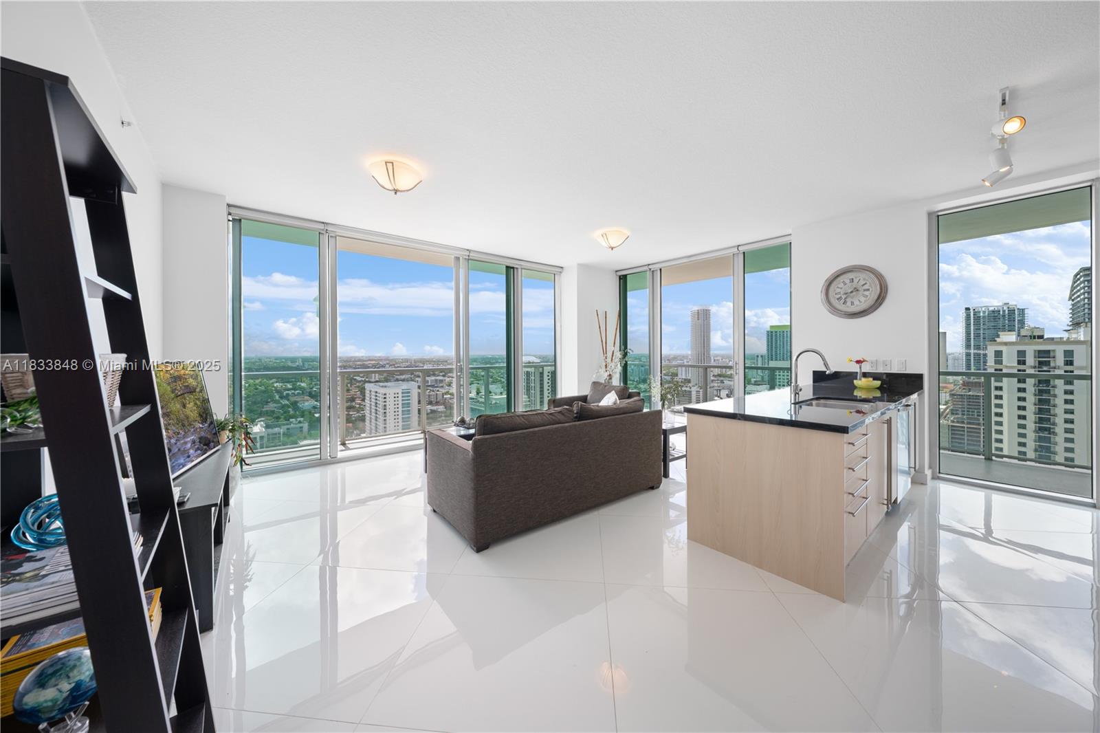 Welcome to the top! This light-filled UNOBSTRUCTED Penthouse at The Axis offers 2 bedrooms, 2 bathrooms, and jaw-dropping views from every room. The spacious balcony? Pure magic. Open kitchen, granite counters, and sleek finishes. Full access to resort-style pools, gym, playroom, and more. Located steps from Brickell City Centre, the Metromover, and the energy of the city. Luxury, location, and lifestyle—all in one.