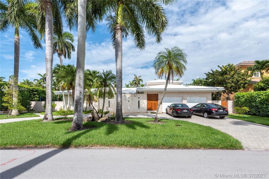 Beautiful mid-century modern home located on Miami Beach’s guard-gated and immaculately manicured La Gorce Island! Circular driveway leads you to an enclosed limestone courtyard with a putting green before entering the home. Inside, open floor plan with huge living areas and wall to wall impact windows overlook the lush backyard. Centrally sited oversized living room, family room with open kitchen, master suite on the 2nd floor featuring wood floors, private terrace, walk-in closets, and luxe bath. Step outside to find yourself surrounded with swaying palm trees, covered wraparound porch surrounding the heated pool, and several play areas. Situated on a huge 13,125-SF lot, this 4 beds 5 bath is equipped with a 1 car garage.