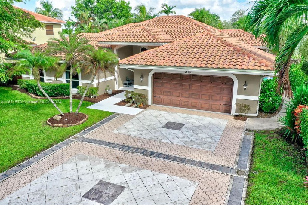 Photo of 5789 NW 48th Ct, Coral Springs, FL 33067 (MLS # A11651573)