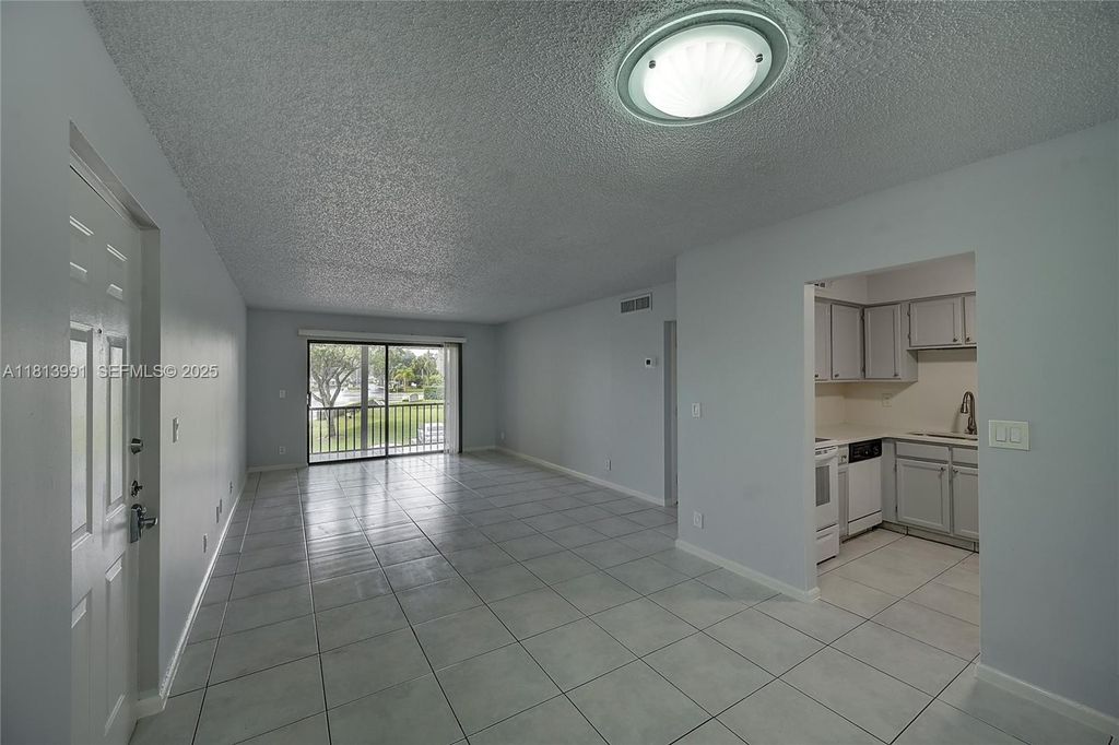Photo of 9965 Pineapple Tree Dr #203, Boynton Beach, FL 33436 (MLS # A11813991)