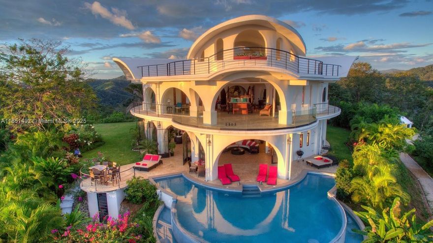 PROPERTY IN COSTA RICA- Imagine waking up in the heart of the jungle, surrounded by breathtaking 360-degree views of the Pacific Ocean, majestic mountains, a serene river, and lush rainforests. Welcome to Casa Redonda, a masterpiece of architecture and design, offering unparalleled luxury, tranquility, and adventure. This stunning 7,000 sq. ft. (approx. 700 sqm) 4 Bedrooms + 4 Bathrooms estate is uniquely crafted for outdoor living, entertainment, and relaxation. Nestled amidst tropical gardens and expansive lawns, Casa Redonda is a private paradise that blends seamlessly with its natural surroundings.