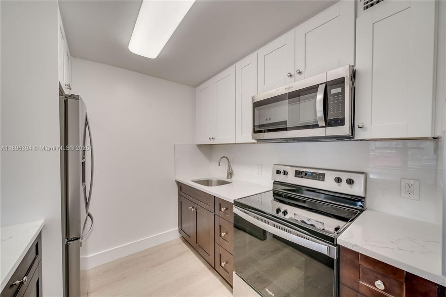 FIRST FLOOR UNIT CABLE, WATER, & INTERNET INCLUDED! Located in the highly desirable CENTURY VILLAGE featuring CONTEMPORARY LUXURY FLOORING, NEW LIGHT FIXTURES, AND CEILING FANS THROUGHOUT. UPGRADED KITCHEN with SOFT-CLOSE ESPRESSO CABINETS, QUARTZ COUNTERTOPS, AND BRAND-NEW STAINLESS STEEL APPLIANCES Both bathrooms are MODERNIZED, with the primary bath showcasing a LARGE RAIN SHOWER HEAD. ENCLOSED PATIO WITH STORAGE & GOLF COURSE VIEW. MILLION-DOLLAR CLUBHOUSE AMENITIES including 2 FITNESS CENTERS, 8 HEATED POOLS AND SPA, TENNIS COURTS, GOLF COURSES, THEATERS, SHOWS, COMPLIMENTARY TRANSPORTATION, & 24/7 SECURITY. On-site conveniences include a MEDICAL CENTER, NAIL & HAIR SALON, AND GROCERY STORE. AT LEAST ONE OCCUPANT MUST BE 55+ (OTHERS 18+). ASSOCIATION REQUIRES 650 MINIMUM CREDIT SCORE.