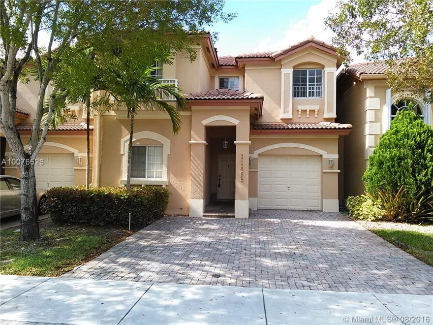 JUST REDUCED....This beautiful hose located in the heart of Doral, close to prime schools, major Highways. Very well located inside of gated community.  The house have 2 stories, one full bedroom and 1 full bathroom in the first floor. Great saloon plus very nice size family room. Kitchen with wood cabinets and granite going with the stainless steel appliances. In the second floor you will find 2 bedrooms and 2 bathrooms, also an ample relaxing area could be used a second family or convert in 4th bedroom