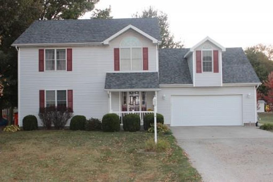 Located on a dead end road at the edge of town, you come to this beautiful two story house sitting on a nice large lot with a country feel.