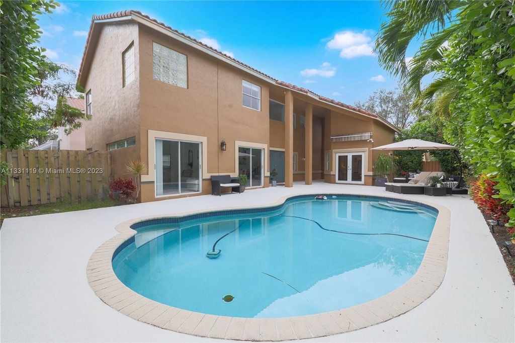 Photo of 6250 NW 58th Way, Parkland, FL 33067 (MLS # A11331119)