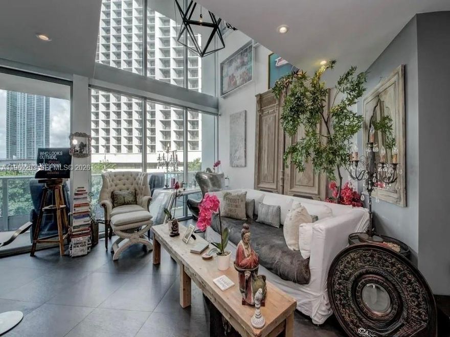 The prestigious Epic Residences is located in the central business district of downtown Miami.Walking distance to the heart of Brickell and 20 minutes from Miami International Airport. 2 story loft with double height floor to ceiling windows.Master Bedroom and full bathroom on second floor with living, kitchen, dining, and half bathroom on first floor. Remote control shades throughout the unit.Available for immideate occupancy.Epic is a full-service building. Hotel managed by Kimpton. Gym and spa managed by Prival.