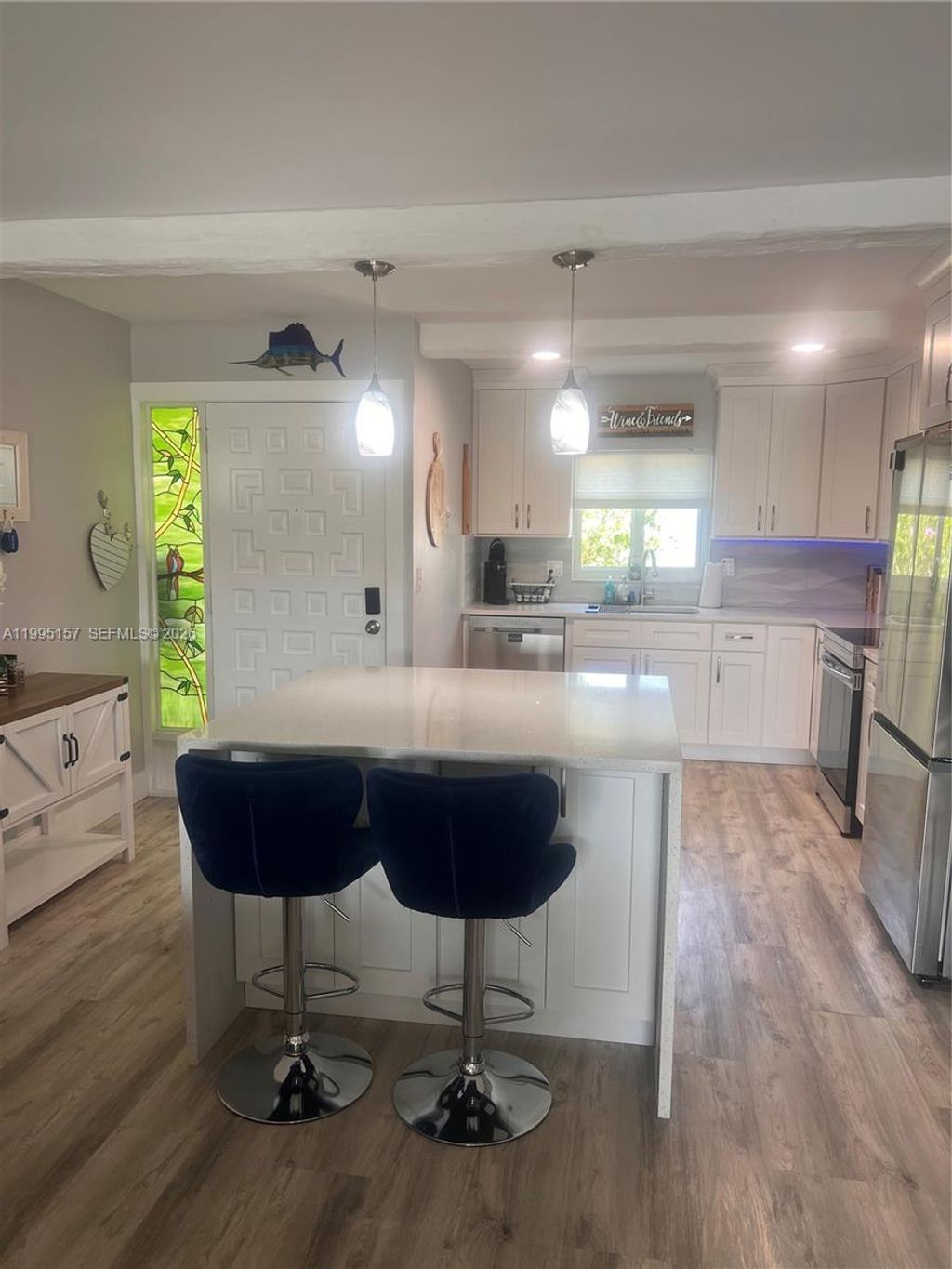 Photo of 1561 NE 12th Ter #, Jensen Beach, FL 34957 (MLS # A11995157)