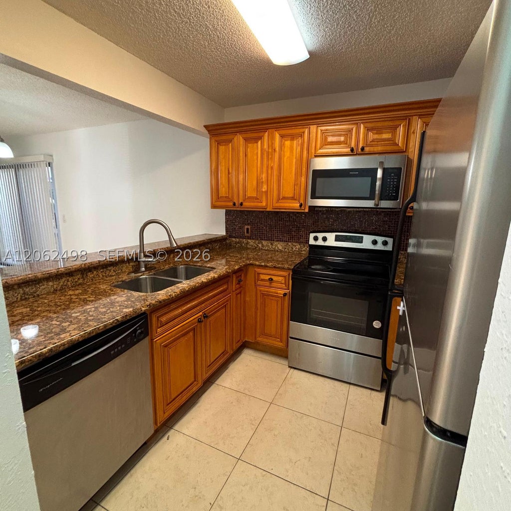 Photo of 1502 Lake Crystal Dr #A, West Palm Beach, FL 33411 (MLS # A12062498)