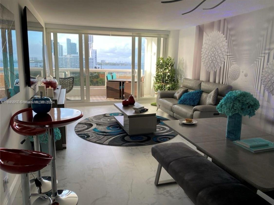 Turn-key, beautifully decorated, state-of-the-art, luxurious apartment with a stunning bay view. Top-of-the-line, energy-efficient, smart appliances and details. Spacious and well distributed with plenty of closet space. Well-appointed deluxe bathrooms and kitchen, with rich details throughout. Large balcony with gorgeous views, perfect for entertaining. One of a kind! Iconic building in Miami's exclusive Arts and Entertainment District, with all the amenities of a luxury resort,