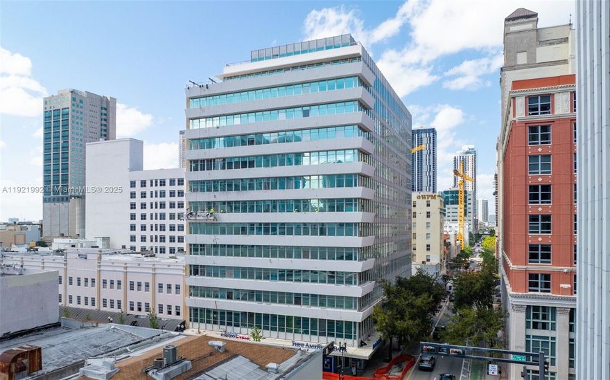 Discover a beautifully designed 1,450-square-foot office suite in the iconic One Flagler Building, ideally located in the heart of Downtown Miami. This fully built-out space features four private offices, a modern kitchenette, and an open layout with exposed ceilings. Enjoy floor-to-ceiling windows that flood the space with natural light. Perfect for creative teams, professional services, or boutique firms seeking a balance of style, function, and location.