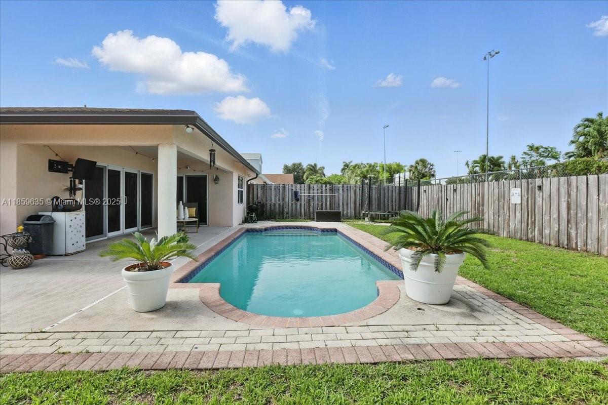 Welcome to your dream home! This delightful one story home features spacious 2 bedrooms & 2 Full bathrooms one-car garage and a stunning pool, ideal for those hot summer days. Full impact windows & doors ensuring safety and energy efficiency. Located in the desirable city of Cooper City, you will benefit from access to excellent schools, making this home perfect for families. The backyard is an entertainer's paradise, perfect for grilling and hosting summer gatherings by the poolside.With low association fees of just $60 a month, this is an incredible opportunity to own a beautiful home in a fantastic community. Don’t wait—schedule a viewing today and make this lovely property your new family retreat!