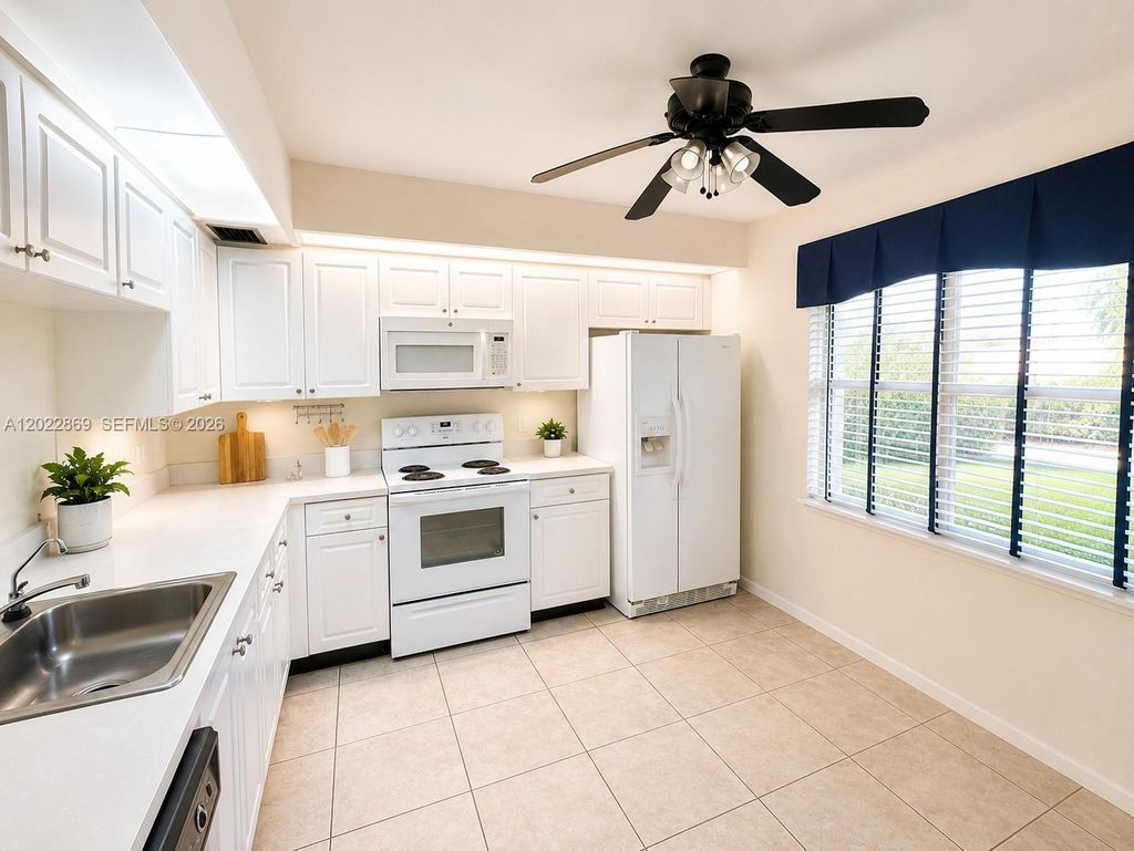 Photo of 1200 SW 125th Ave #208L, Pembroke Pines, FL 33027 (MLS # A12022869)