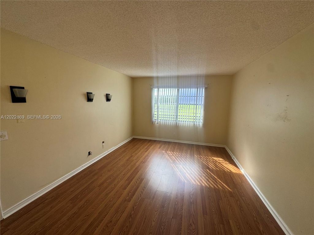 Photo of 1200 SW 125th Ave #208L, Pembroke Pines, FL 33027 (MLS # A12022869)