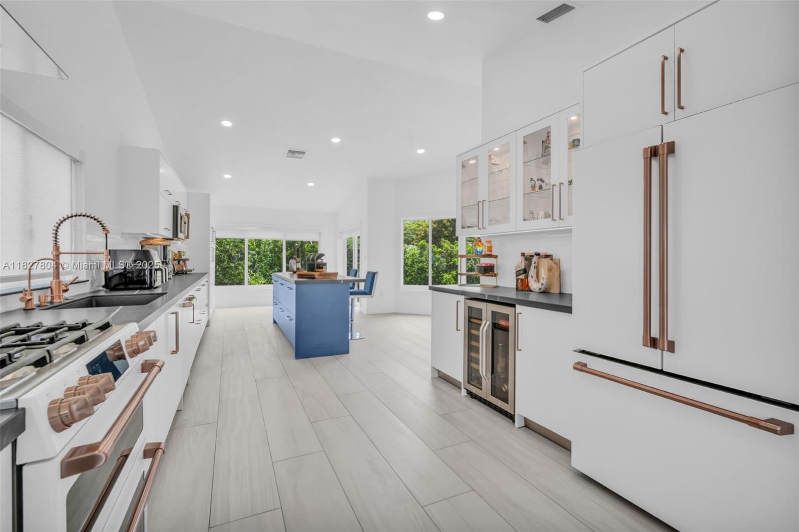 Beautifully upgraded 2-story home in sought-after Lago Mar community of West Kendall. This 4-bedroom, 2.5-bathroom gem has been fully remodeled with exceptional attention to detail. It features sleek porcelain flooring throughout, vaulted ceilings, and high-impact windows/doors. The stunning kitchen boasts GE Café appliances, a kitchen island, porcelain countertops, tiled backsplash, and modern cabinetry. The garage was thoughtfully converted into a massive custom-built walk-in closet for the primary suite. Additional upgrades include a large utility/laundry room with abundant storage, a tankless water heater, a water filtration system, and a new AC system with handler, condenser, and ducts installed in 2020. The spacious backyard features guava and plum trees. This home is move-in ready!