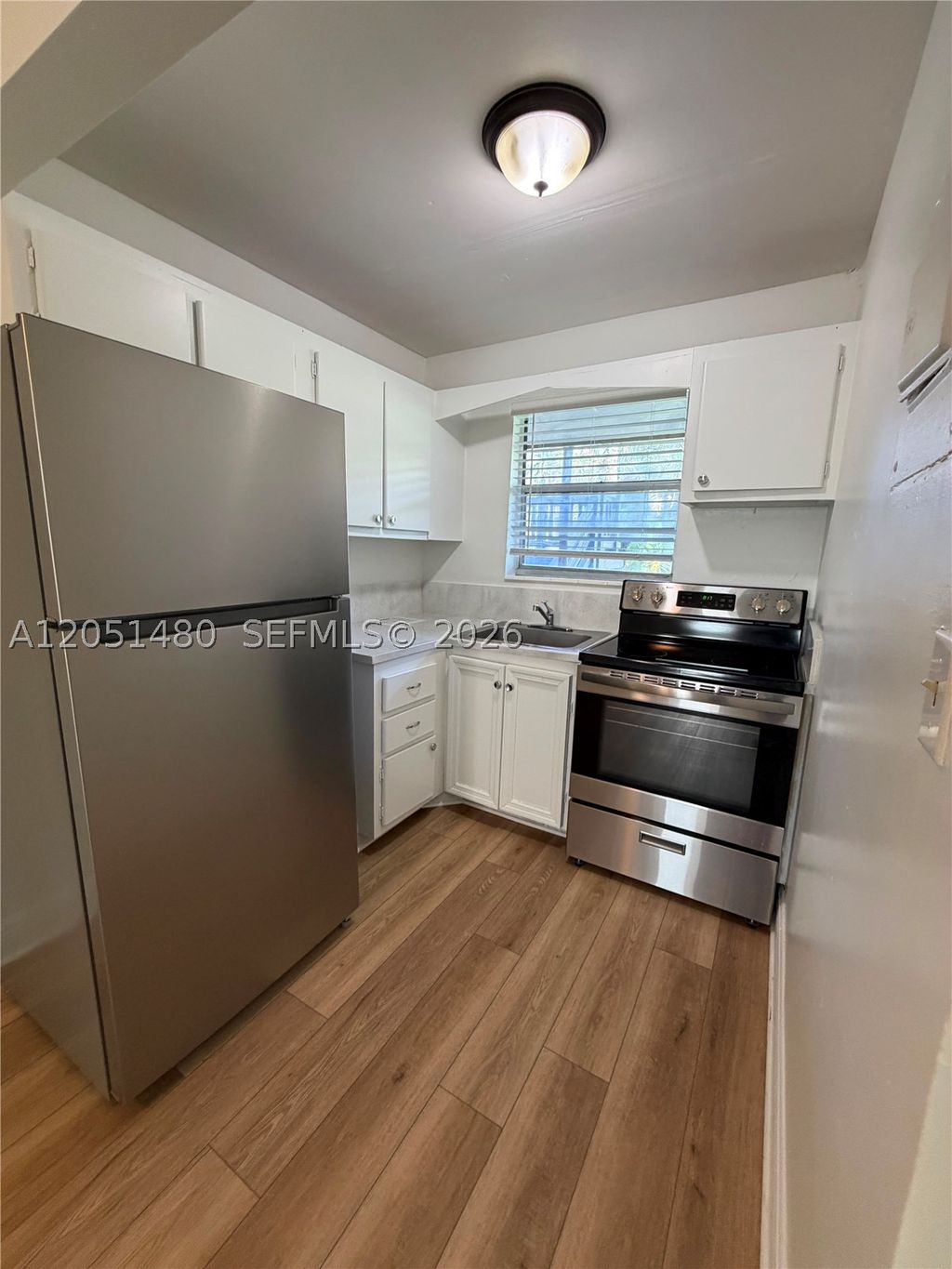 Photo of 7041 Sunset Strip #109, Sunrise, FL 33313 (MLS # A12051480)