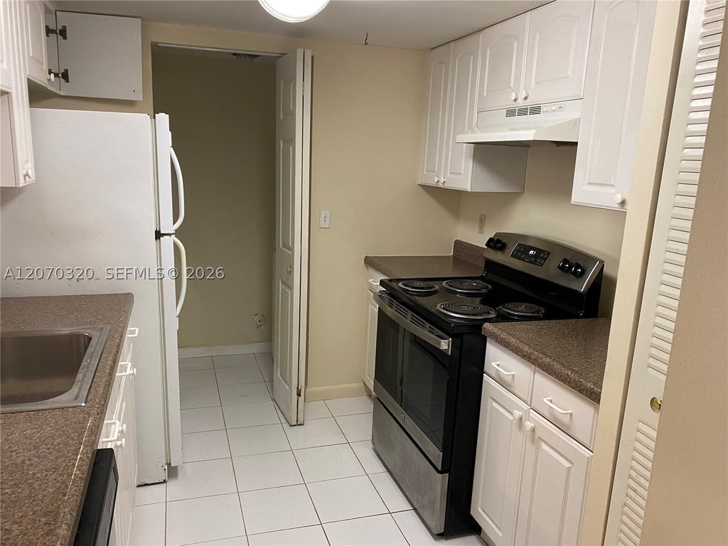 Photo of 9755 Westview Dr #1215, Coral Springs, FL 33076 (MLS # A12070320)