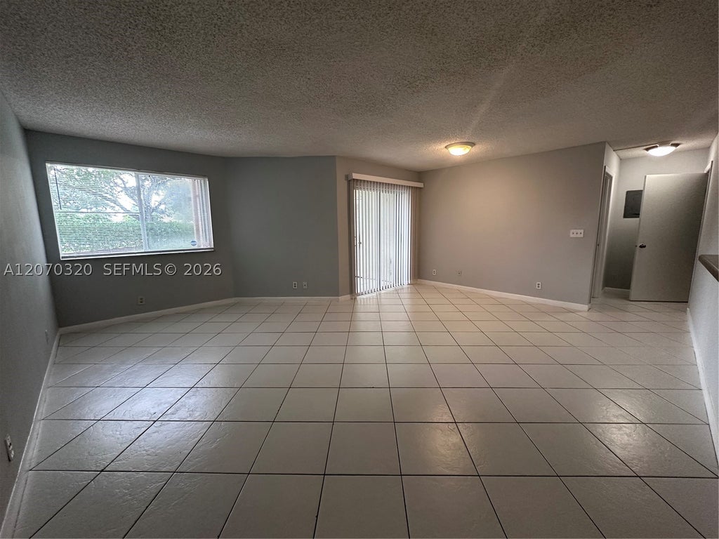Photo of 9755 Westview Dr #1215, Coral Springs, FL 33076 (MLS # A12070320)