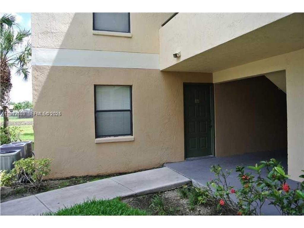 Photo of 9999 Summerbreeze Dr #301, Sunrise, FL 33322 (MLS # A11927606)