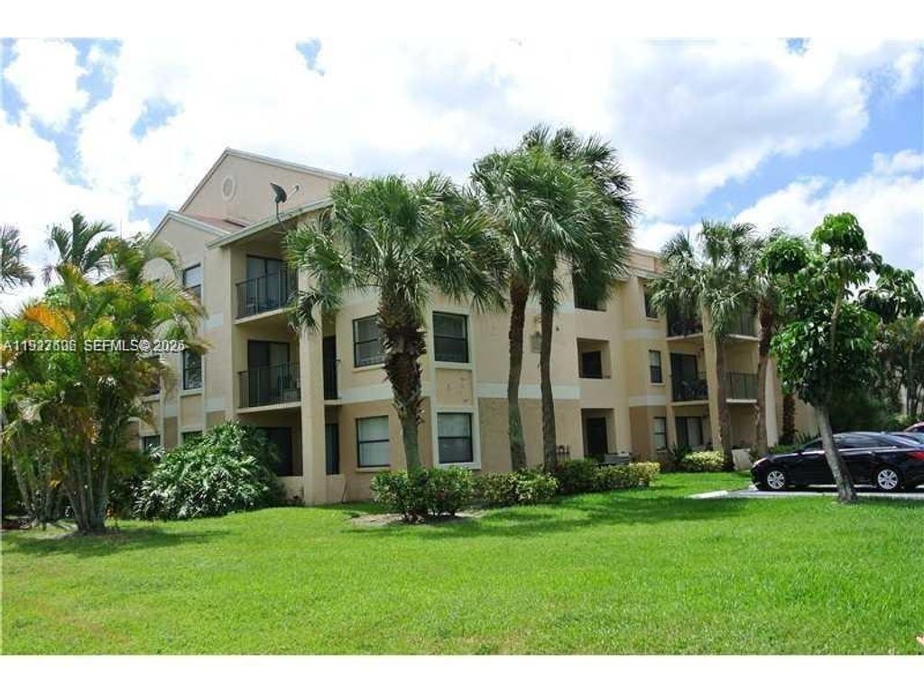 Photo of 9999 Summerbreeze Dr #301, Sunrise, FL 33322 (MLS # A11927606)