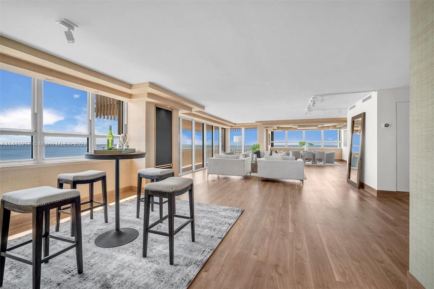 Spectacular 270 degree ocean view at this 5,012 sqft. Grove Isle Condo! Conveniently located at the heart of Coconut Grove. Apartment bathrooms and kitchens have been remodeled. Large Library/Office. New appliances (washer, dryer, fridge, freezer, stove, oven, ice maker, cooktop). Striking virtual light sculpture by Earl Reiback installed in the living room. New wine cellar chilling system. Hallway remodeling almost complete. Marina slips available for purchase/rent with apartment. Gated community with 24 hour security, valet, gym, and beach access.