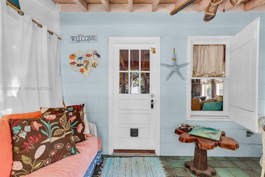 Step back in time and experience the charm of Old Florida in this 1934 historic cottage, one of the most historic homes in the Old Tavernier Showcasing superior wood craftsmanship, this adorable 1-bedroom, 1-bath residence offers timeless appeal. The home sits on a spacious, fenced lot, creating a private backyard oasis surrounded by mature trees, perfect for relaxing or entertaining outdoors. Inside, warm wood finishes and classic design details speak to the home's storied past. Located in the heart of Tavernier, this property offers easy access to neighborhood beaches and a local boat ramp, as well as restaurants, coffee shops, grocery stores, the hospital, and a movie theater, all just moments away. The quiet streets of Old Tavernier invite leisurely strolls or bike rides through this beloved, character-rich community. A rare opportunity to own a piece of Keys history and enjoy the authentic island lifestyle that never goes out of style.