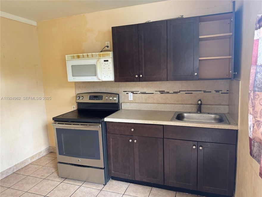 Cozy and affordable efficiency available in Lauderdale Lakes!  This spacious unit features a functional kitchenette with modern cabinets, an electric stove, a microwave, and a refrigerator to be installed, and a tiled backsplash.  The 
Efficiency also features a full bathroom with a tiled shower area and a comfortable sleeping/living space, complete with a ceiling fan and natural lighting.  Located in a quiet residential neighborhood with easy access to major highways, shopping, dining, and public transportation.  Water and electricity are included.  Suitable for a single occupant.