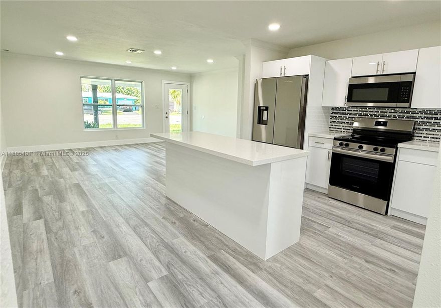 Enjoy ocean access (fixed bridges) from your private dock—ideal for kayaking, paddleboarding, or small boats. Welcome to Hidden Royal Palm Acres in Oakland Park! 3-bedroom, 2-bath waterfront home is an entertainer’s dream. UNDER AIR 1,349 SQFT wit a Total 1,624 sqft on a fenced Lot of 6,399 sqft. This tropical oasis offers ocean-access waterfront with a private dock. FULL IMPACT WINDOWS, IMPACT DOORS AND NEW ROOF 2025. Designed with open-concept layout showcases an exquisite kitchen bathed in natural light, featuring luxurious granite countertops and high-end finishes that are sure to impress. Step outside where you can enjoy the tranquil waterfront breeze & picturesque views—perfect for relaxing / hosting unforgettable gatherings. This home offers the perfect blend of elegance & confort.