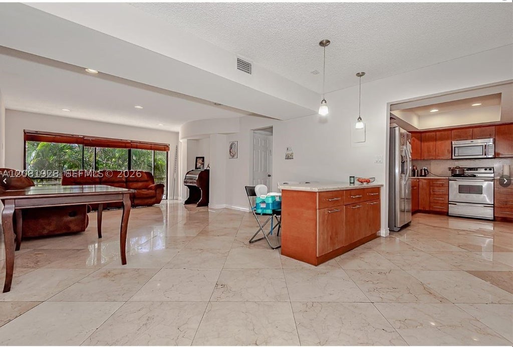 Photo of 4000 N Hills Dr #29, Hollywood, FL 33021 (MLS # A12081928)