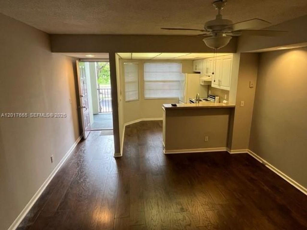 Photo of 1300 SW 130th Ave #210F, Pembroke Pines, FL 33027 (MLS # A12017665)
