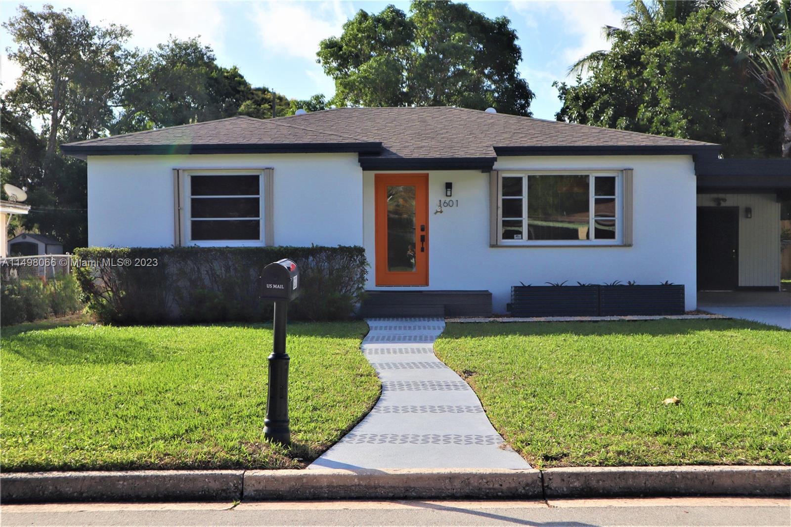 Charming and inviting, this Lake Worth Heights residence offers comfortable living in a serene location. This 2/1 remodeled bath boats a modern, updated kitchen with elegant white cabinetry, granite countertops and stainless appliances. Enjoy the spacious, meticulously landscaped oversized backyard featuring a deck and patio for relaxing or entertaining. The detached laundry comes equipped with new washer and dryer units and abundant storage space. With a 2021 roof and a 2019 HVAC system, this home ensures both comfort and peace of mind. Additional features include accordion hurricane shutters and impact doors for added security. Carport and driveway. Great for first time homebuyers or investors (no HOA). Do not miss this opportunity!!!